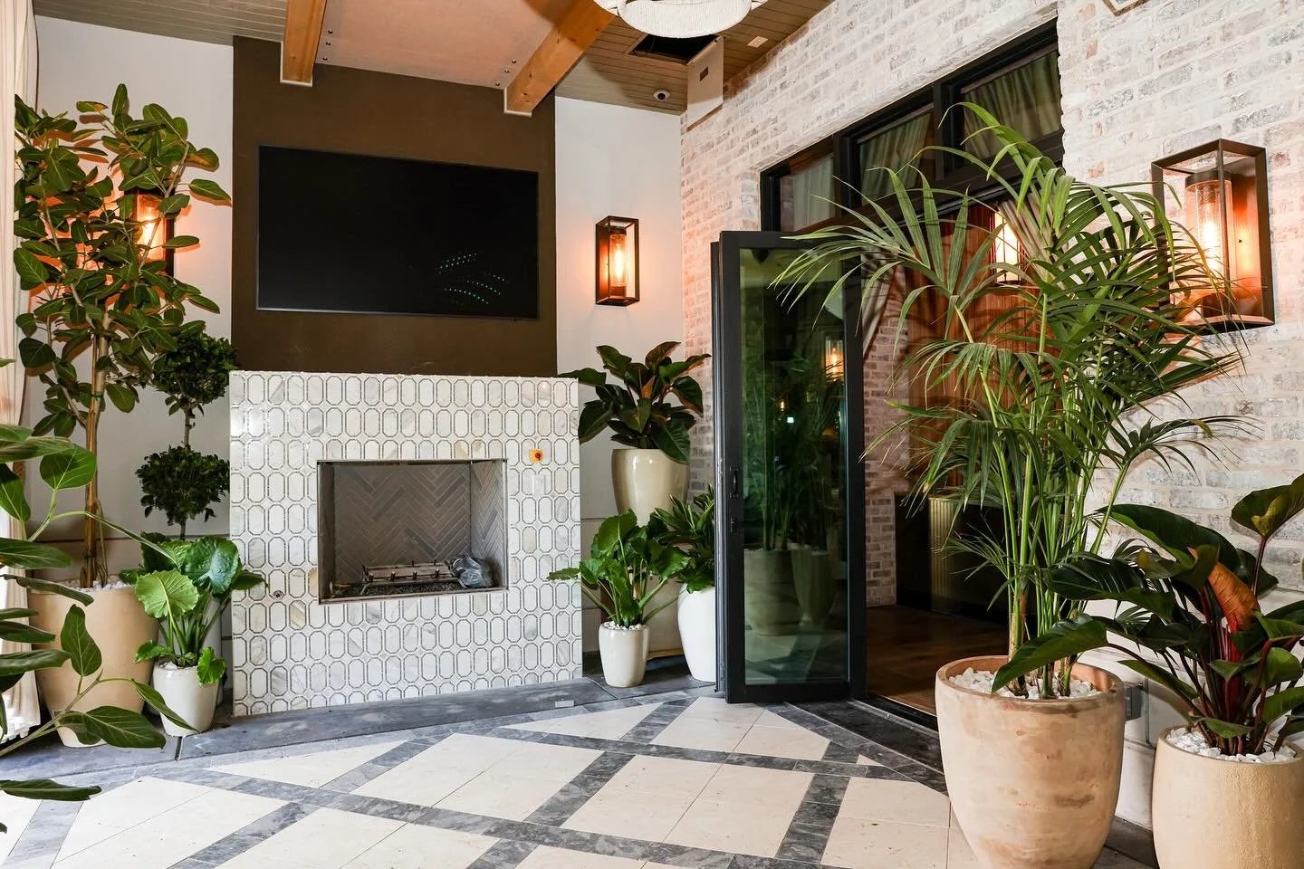 Planted hotel lounge with fireplace